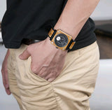 Yellow square face watch on wrist
