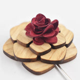 Pale wooden lapel pin with red flower