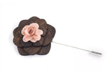 Dark wooden lapel pin with pink flower